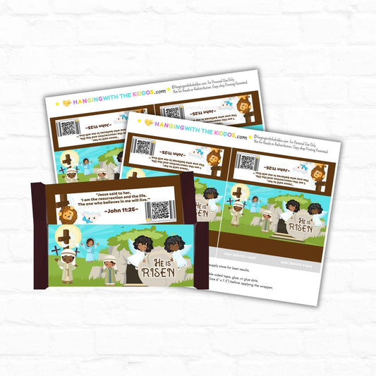 He Is Risen Easter candy bar wrappers featuring cartoon Jesus, cross, and tomb scene. DIY religious favor for Easter baskets and Sunday school events.