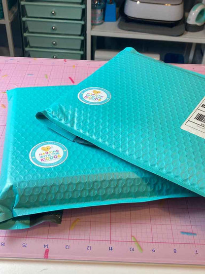 Glossy Chip Bag Paper – DIY Party Favor Sheets packaged in teal bubble mailers, ready for delivery to crafters and party planners.